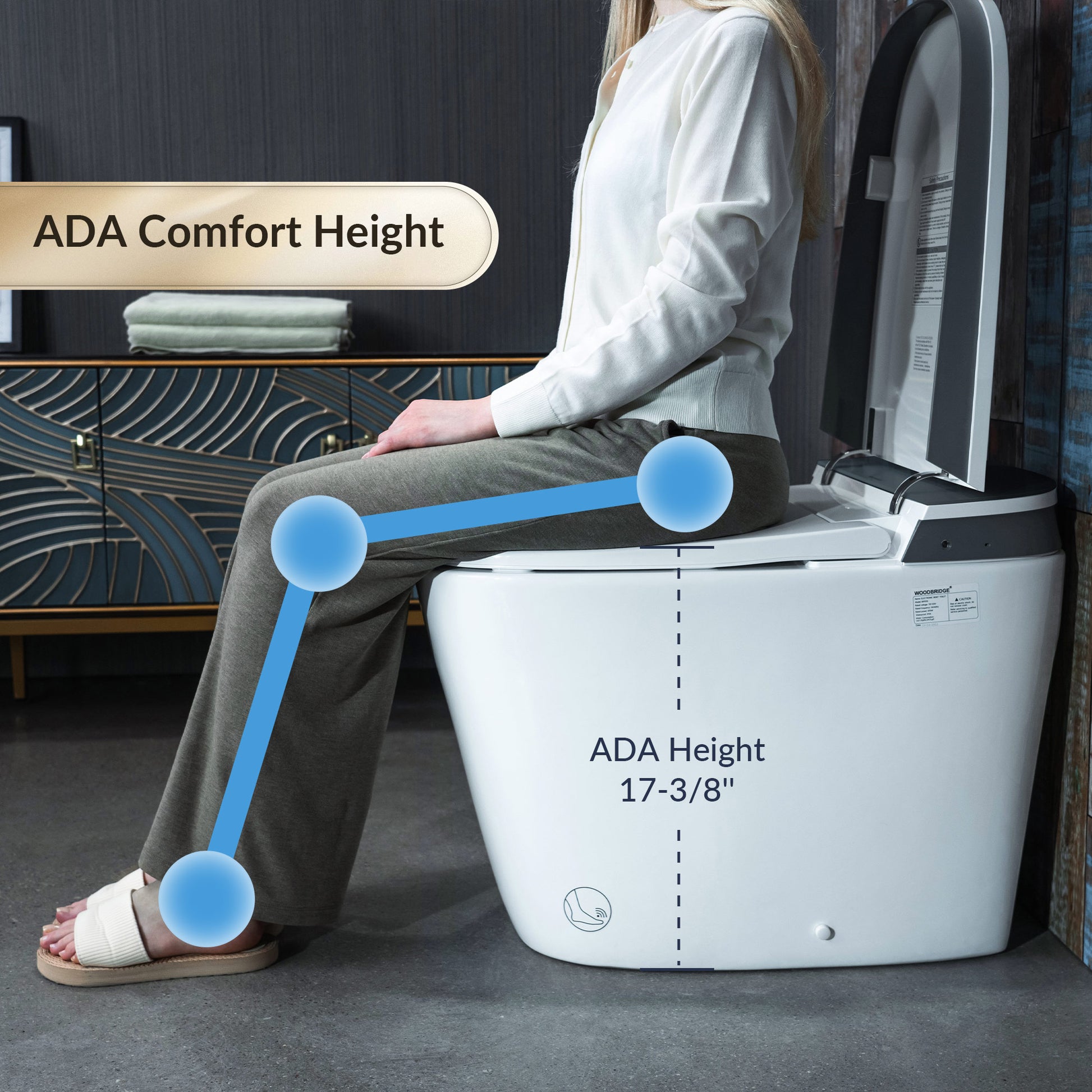 Person using a white toilet with ADA height label, sitting on a gray floor.